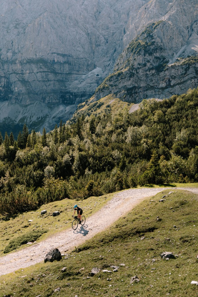 Cyclist on a mountain gravel path