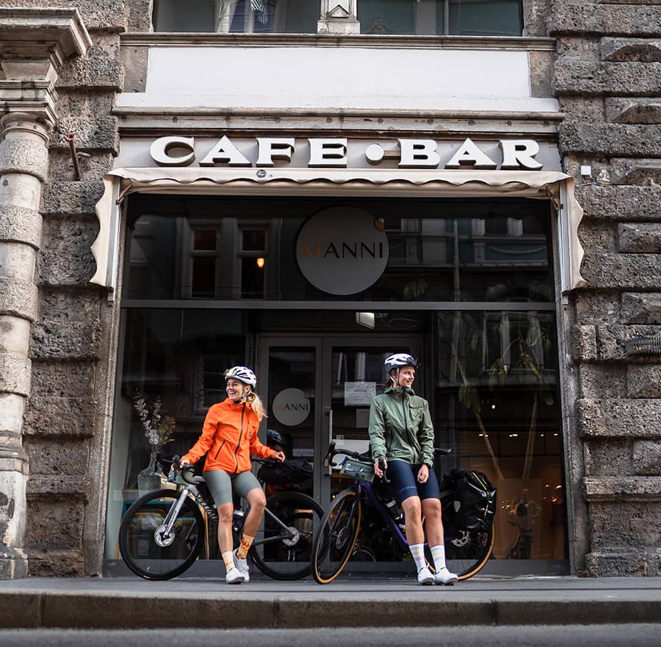Cyclists outside a café bar
